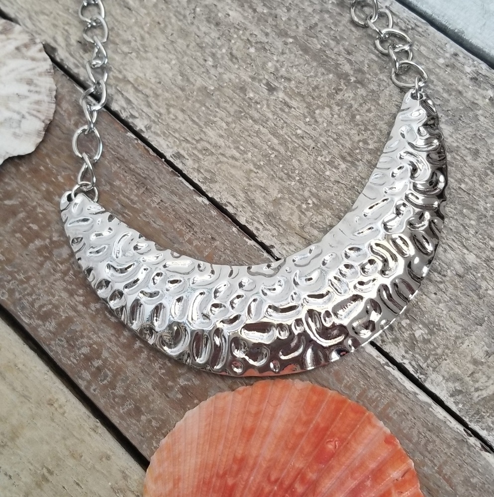 Costume jewelry hammered crescent style necklace